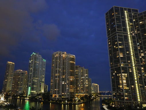 The Brickell Key skyline is seen at dusk in downtown