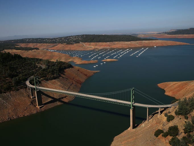 The Green Bridge passes over low water levels at a section of Lake Oroville near the Bidwell Marina on August 19, 2014 in Oroville, California. As the severe drought in California continues for a third straight year, water levels in the State's lakes and reservoirs is reaching historic lows