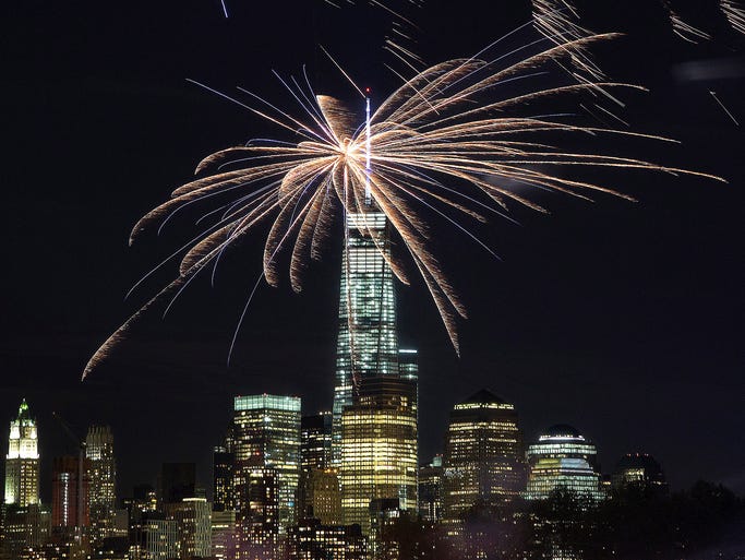 Fireworks launched from Hoboken, N.J., light up the sky over the One World Trade Center building on Sept. 7 in New York.