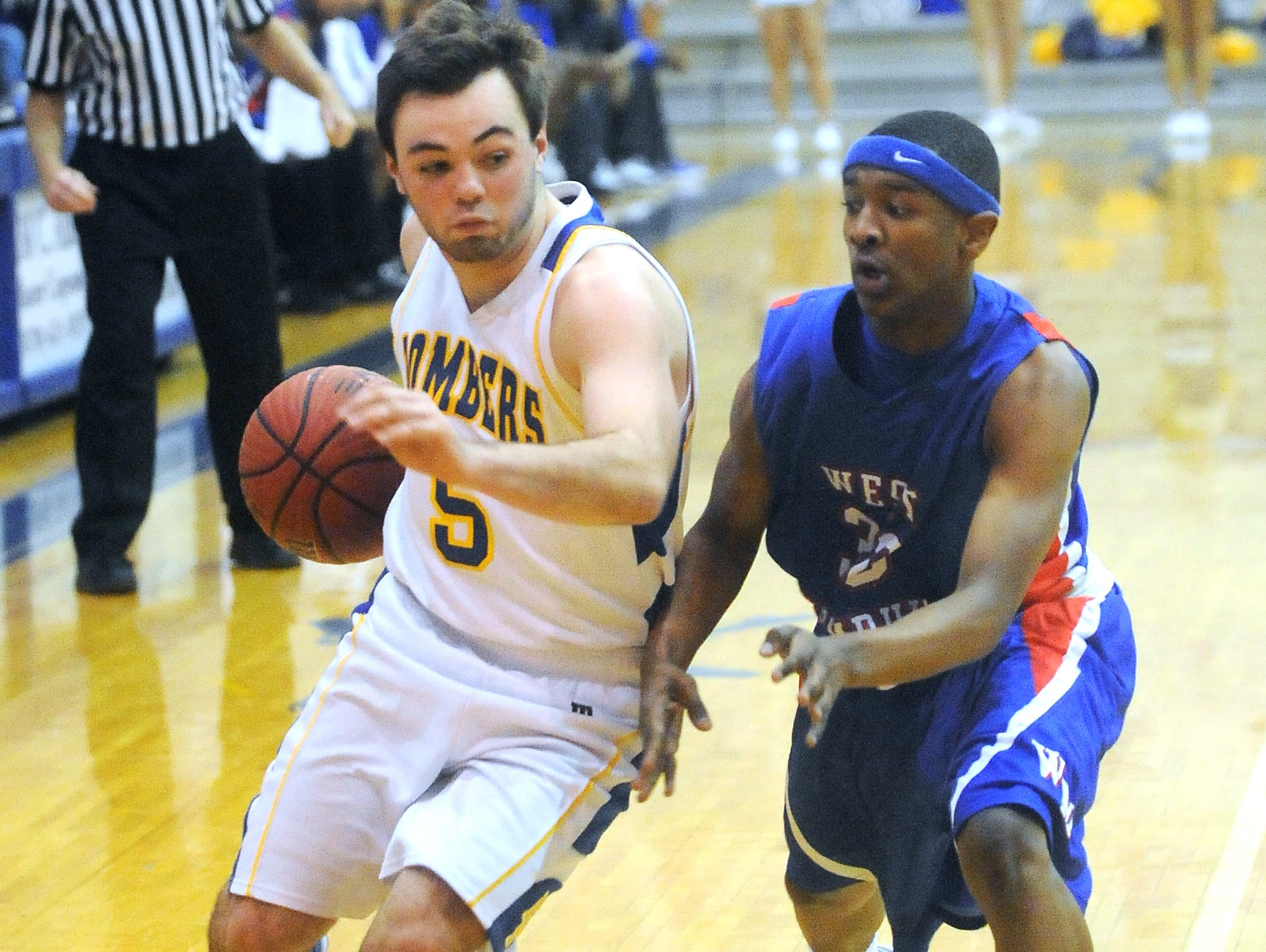 Mountain Home’s Preston Groesbeck drives past a West Memphis defender during a game this past season at The Hangar. Groesbeck signed a National Letter of Intent on Wednesday to play at North Arkansas College in Harrison.