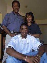 Marcus Taylor poses with his parents, James and Kay,