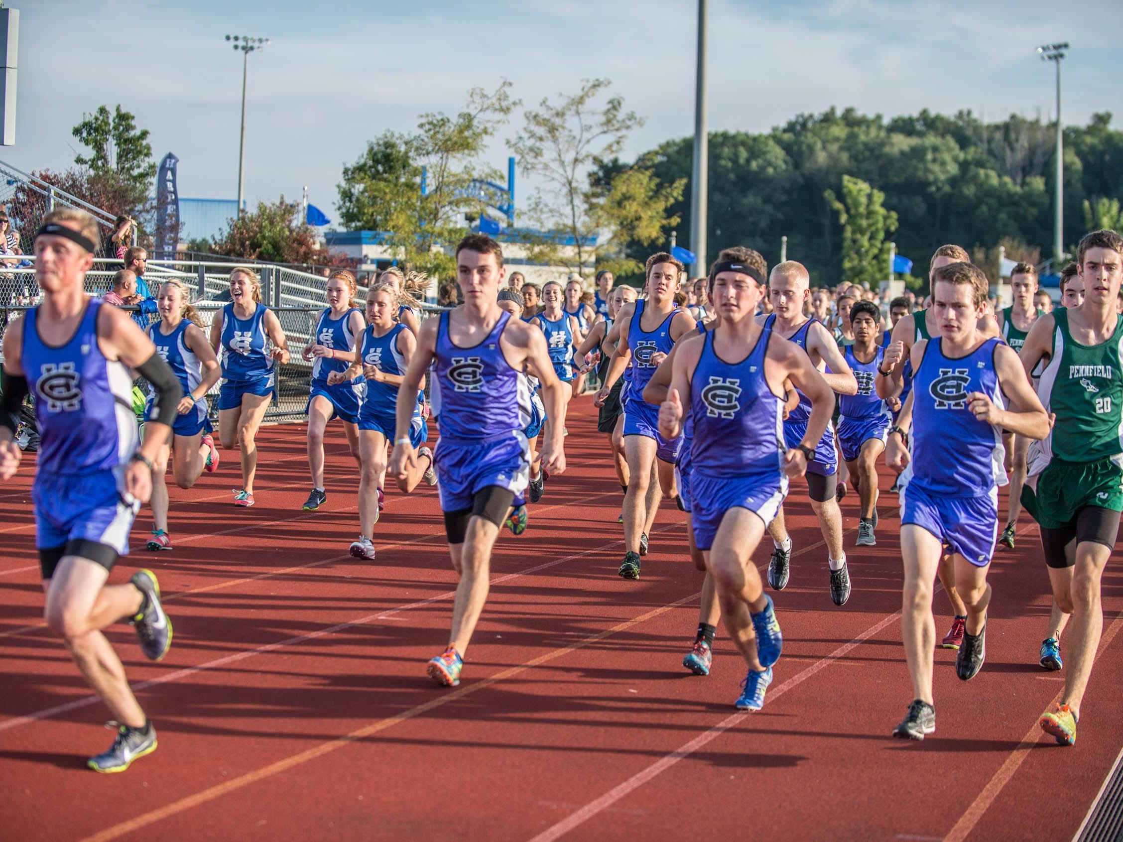 Harper Creek and Pennfield runners at the start of Friday’s cross country meet at Harper Creek.