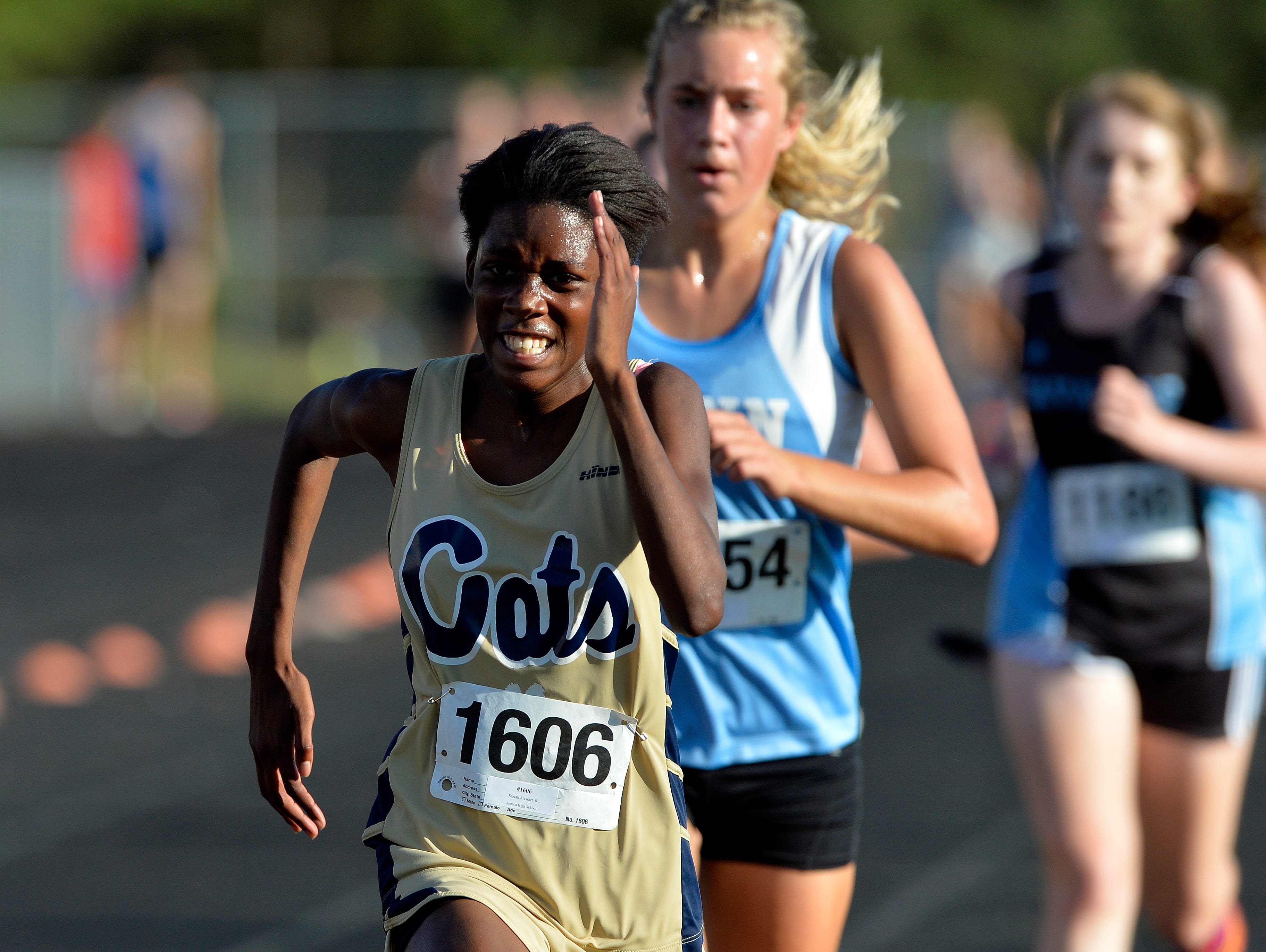 Area high school runners participate in the Canned Food 5k cross country race at Hillcrest High School on Wednesday, September 23, 2015.