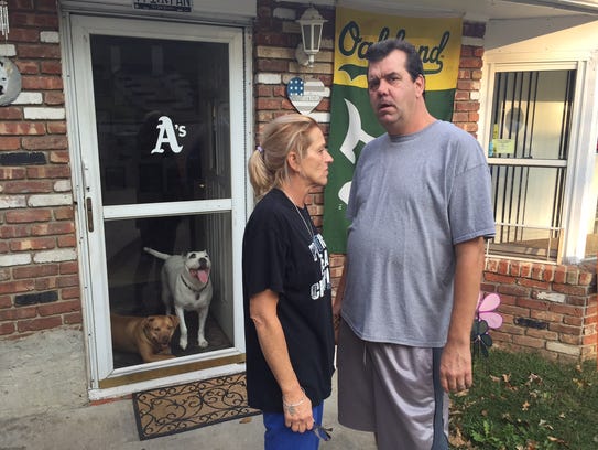 Mike Nolan's parents Donna and Jimmy Nolan  stand outside