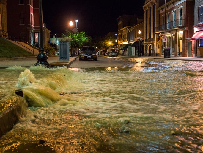 The flooding occurred at the corner of South Second Street and Madison Street after a fire hydrant was damaged.