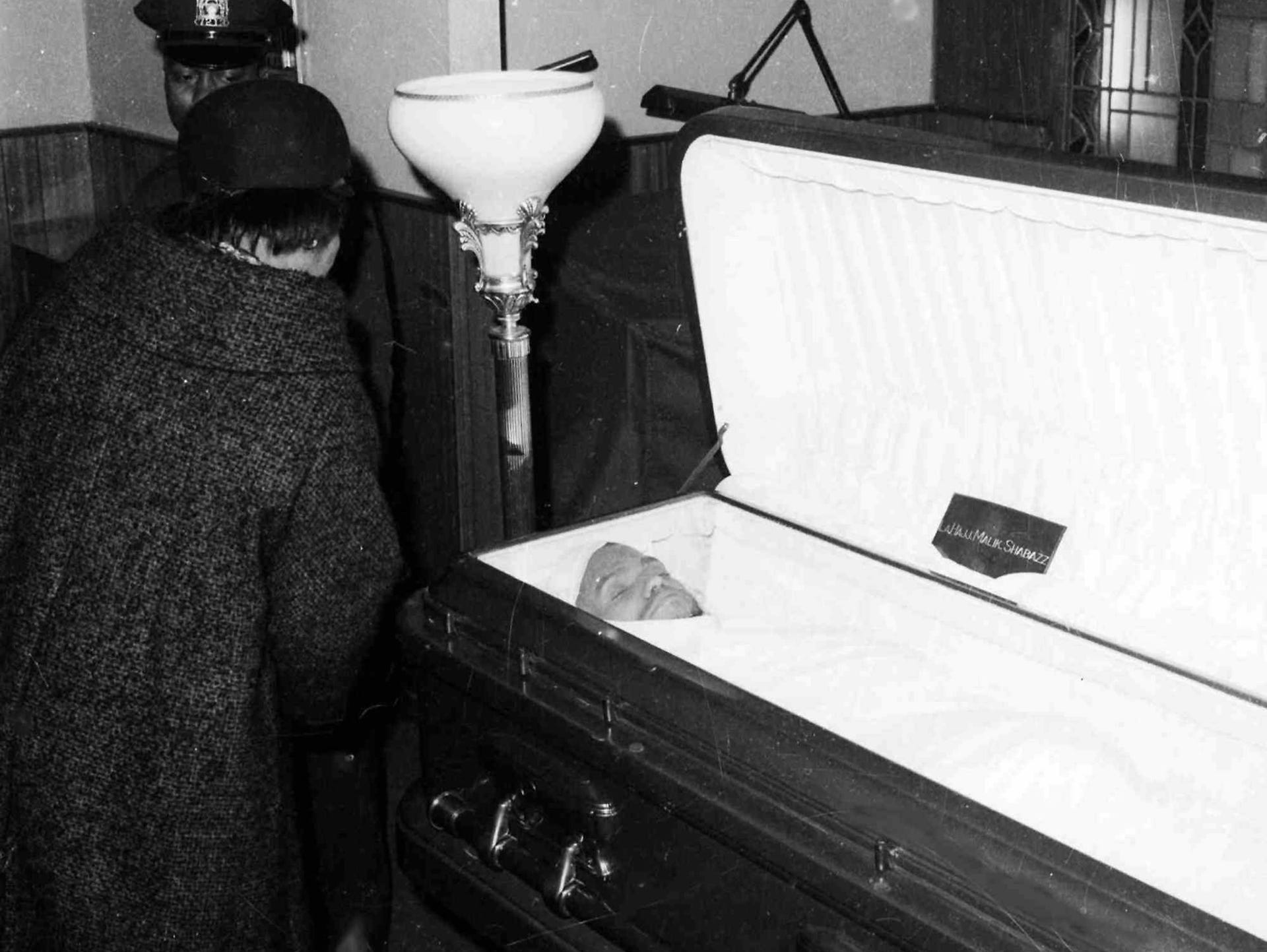 LE--Malcolm X's widow, Betty, takes a last look at