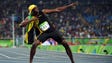 Usain Bolt (JAM) celebrates after winning the men's