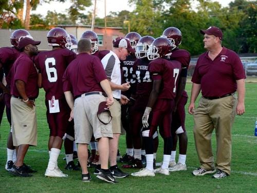 PHS coach Mike Mincy, right, and the Tigers are in a must-win situation this Friday vs. Mosley.
