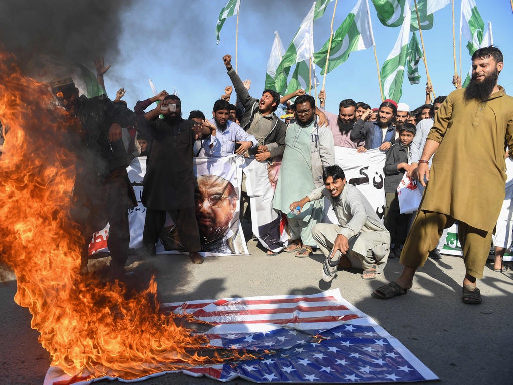Activists of the Difa-e-Pakistan Council shout anti-U.S. slogans at a protest in Karachi, Pakistan, on Jan. 2, 2018. Pakistan has summoned the U.S. ambassador, an embassy spokesman said Jan. 2, in a rare public rebuke after Donald Trump lashed out at