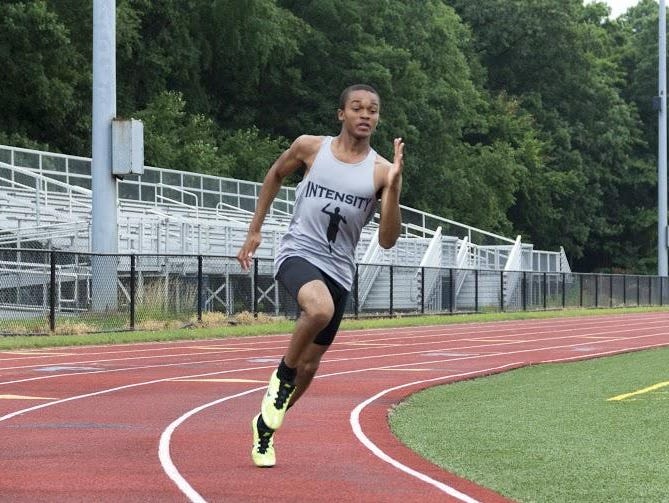 Malik Jordan rounds the corner during a recent Intensity Track Club practice.