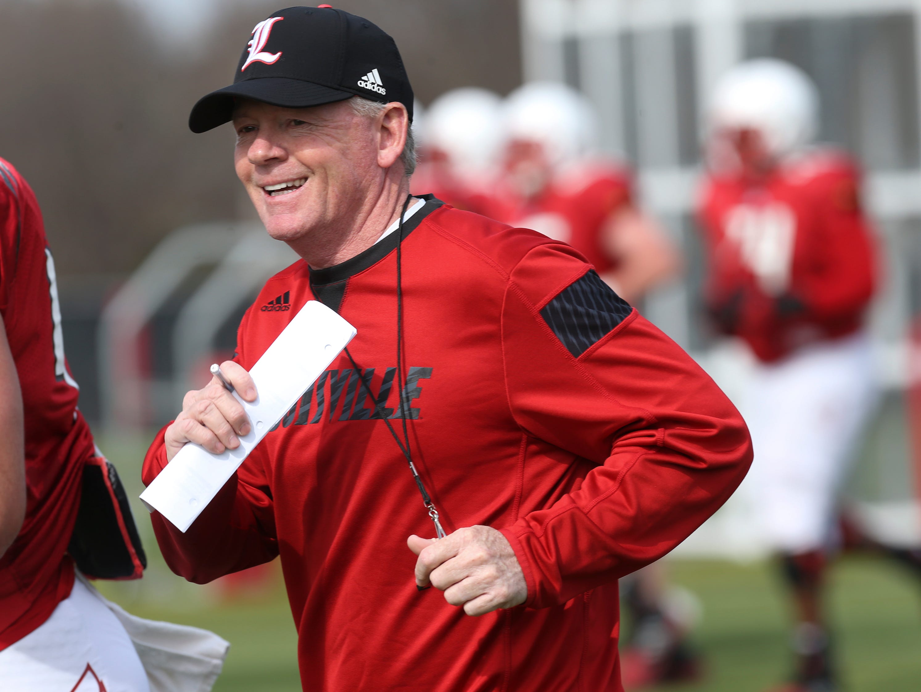 U of L head coach Bobby Petrino smiles during practice. Mar. 29, 2016