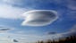 Lenticular clouds float above Edinburgh, Scotland,