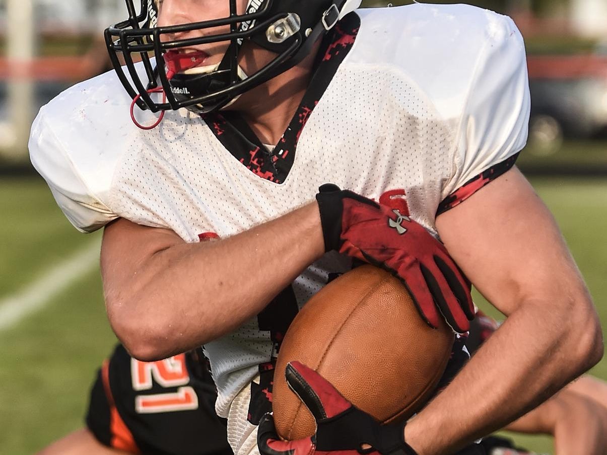 Cardington's Daniel Kill takes the ball down field for an effective run during the Cardington vs North Union football game hosted at North Union.