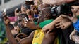 Usain Bolt (JAM) celebrates with fans after winning