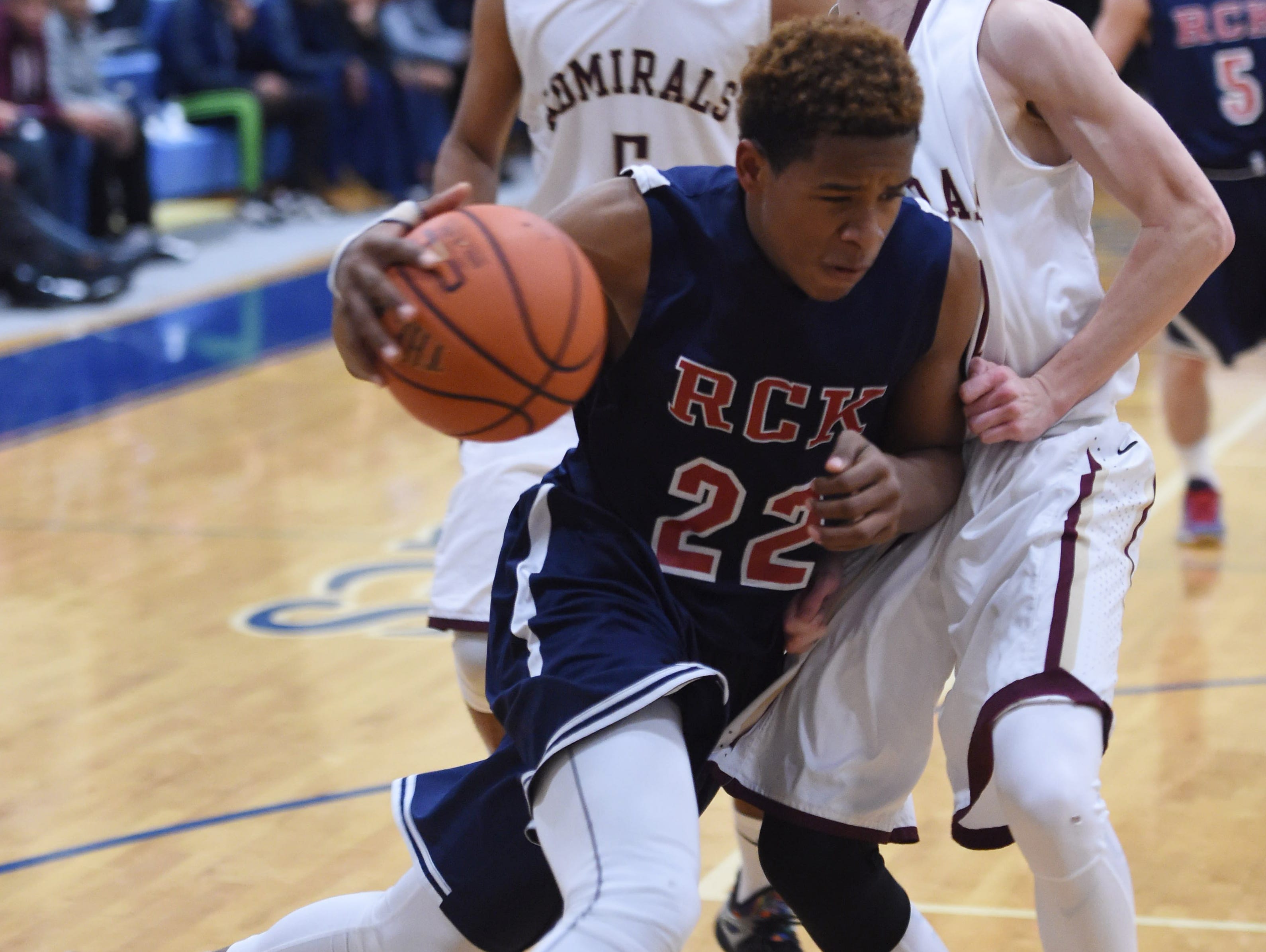 Ketcham's Zaahir Woody drives through Arlington's Tom Duffy during the Duane Davis Memorial Holiday Tournament in Poughkeepsie on Wednesday.