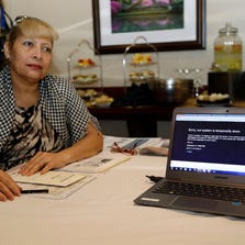A woman waits to talk to a navigator about health care options under the Affordable Care Act on Tuesday in Miami.