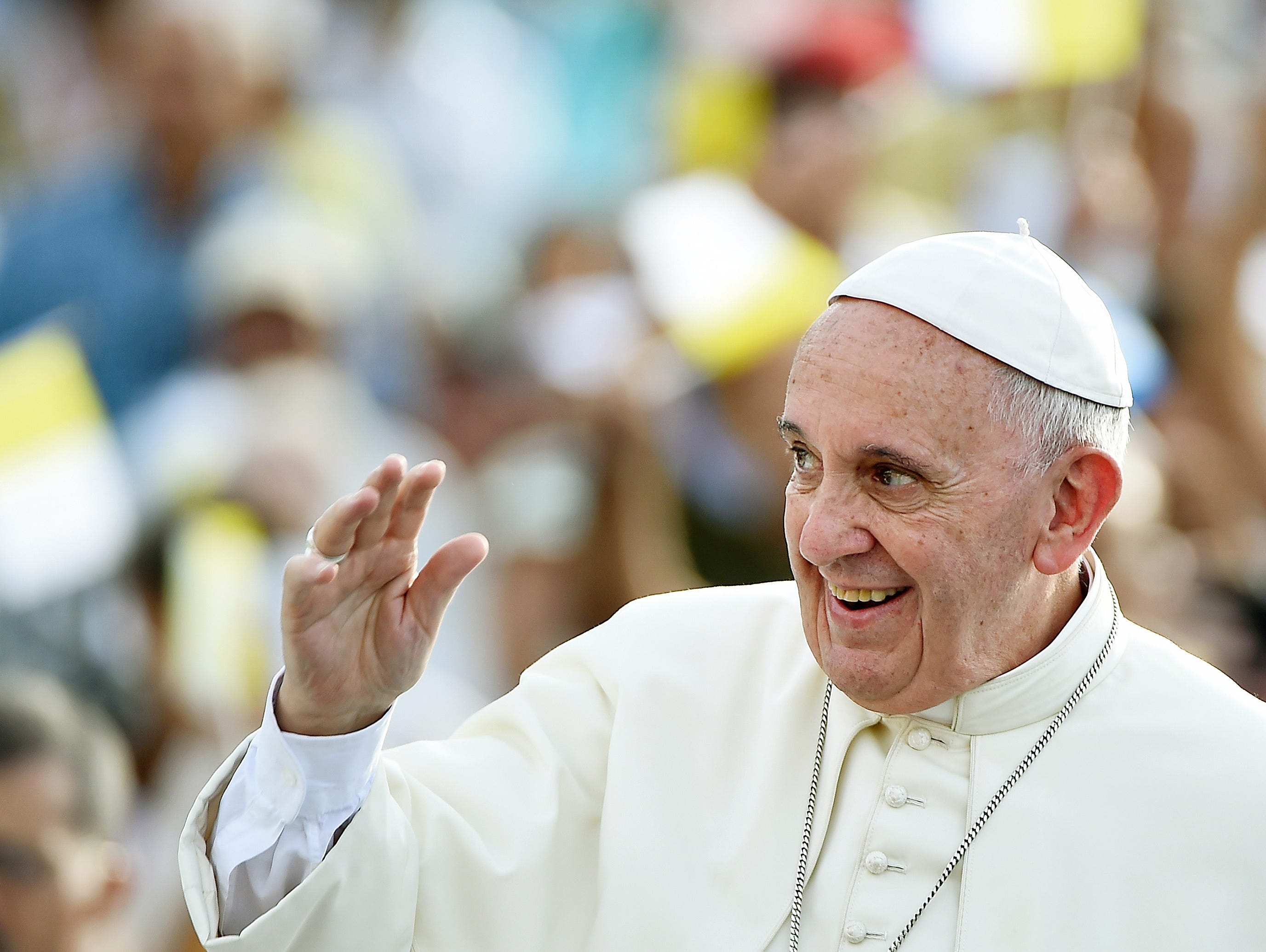Pope Francis waves to the crowd upon his arrival in Santiago de Cuba. Santiago, the last stop on Pope Francis's Cuban tour, is known for its revolutionary history, its rum and the troubadours who have infused the Caribbean island's music with their t
