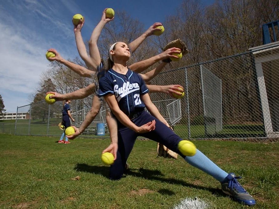 Suffern pitcher Kate Wood pitches from a kneeling position at the start of her warmup before a home game April 28, 2015.