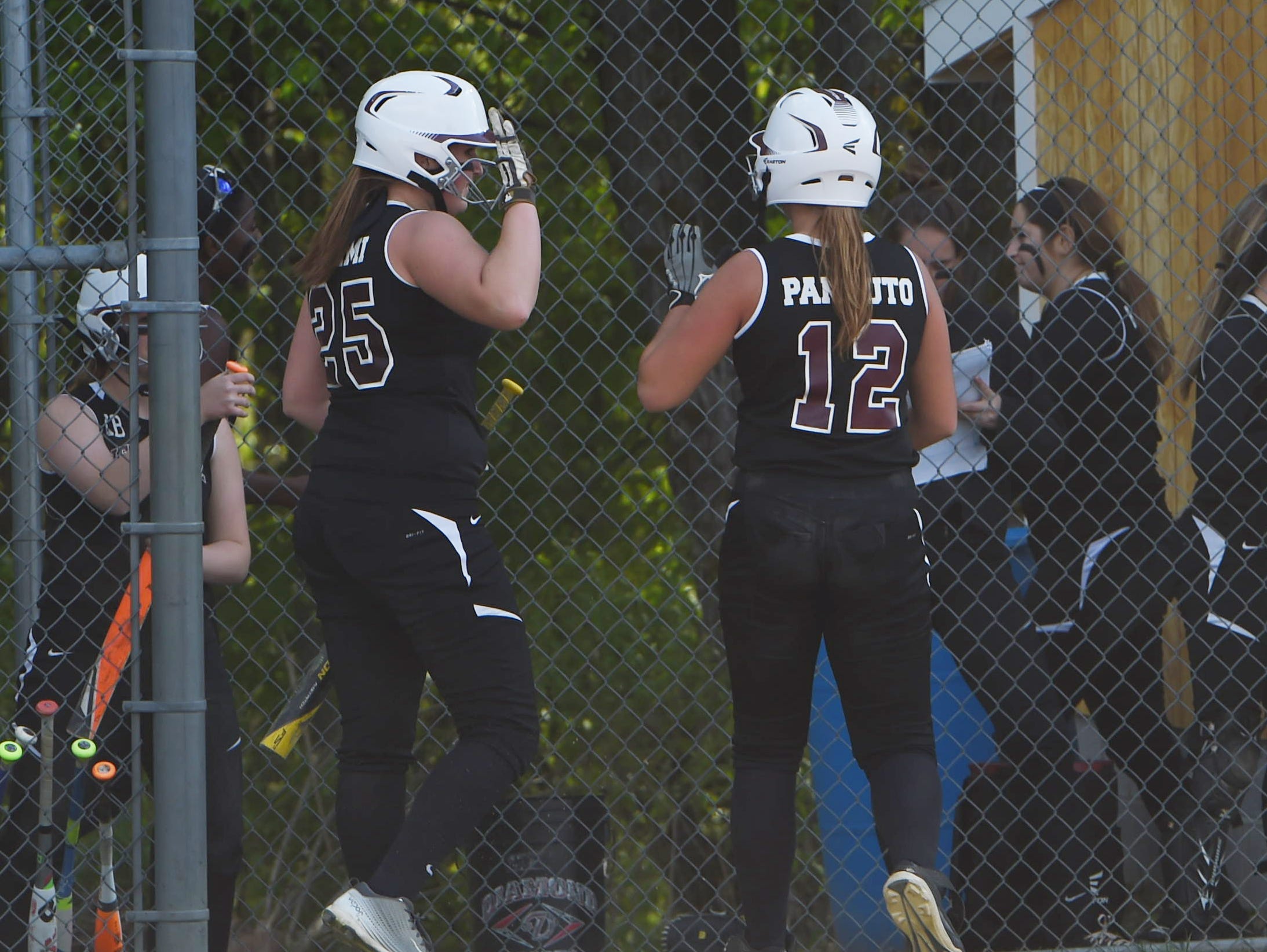 New Paltz's Adriana Crimi and Ally Pannuto go for a high-five during Monday's game against Marlboro.