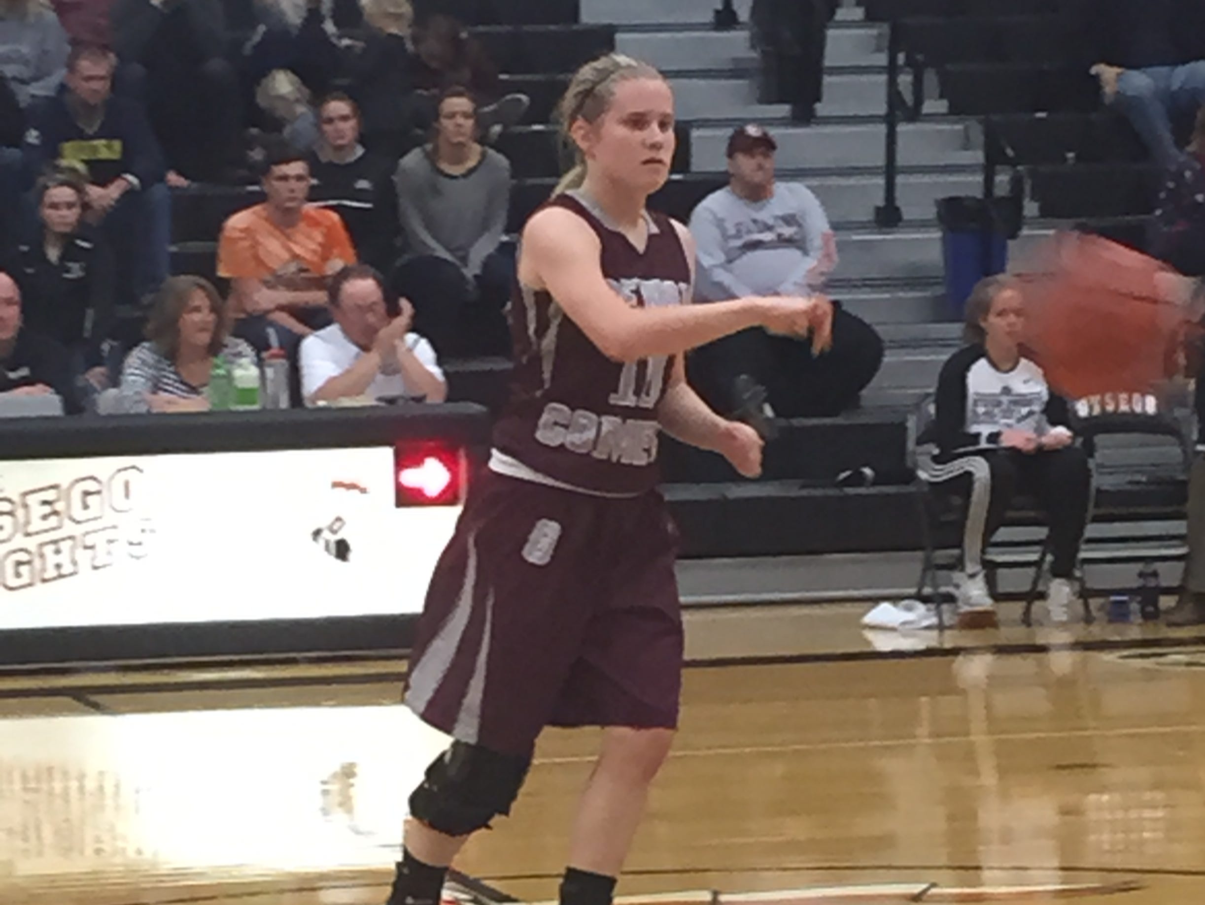 Genoa's Haley Gerke passes to a teammate Friday in a victory over Otsego in the NBC.