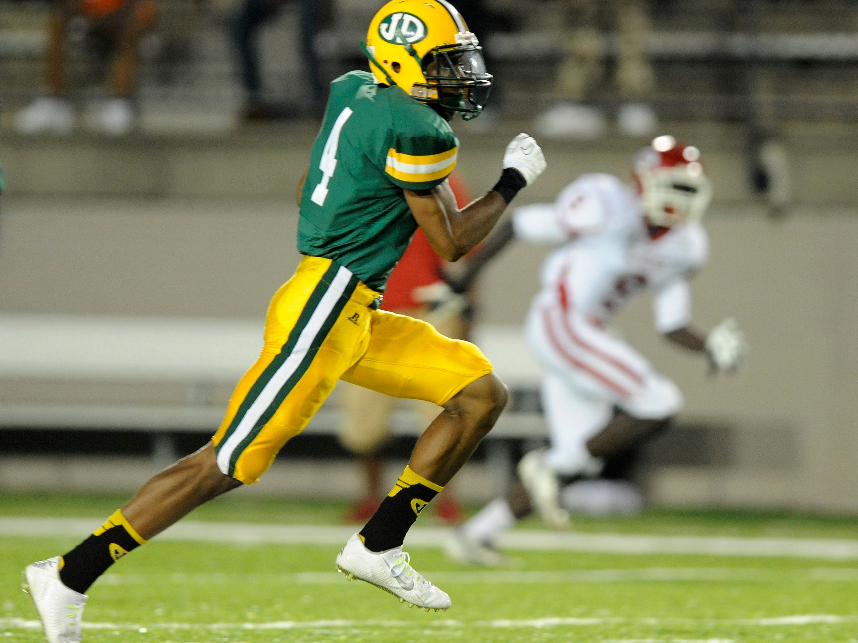 Zyon Gilbert of Jeff Davis returns an interception for a touchdown against Robert E. Lee at Cramton Bowl on Friday.