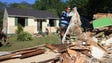 As floodwaters recede, the cleanup efforts begin in