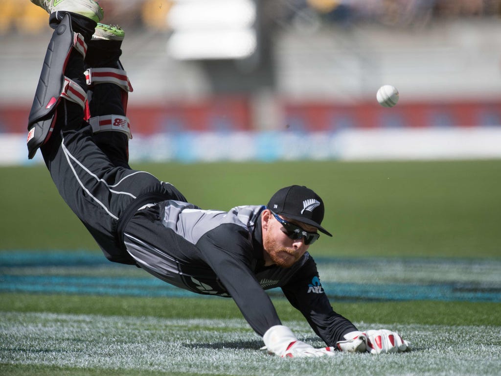New Zealand's Glenn Phillips attempts to catch Pakistan's Umar Amin during the first Twenty20 international cricket match between New Zealand and Pakistan at Westpac Stadium in Wellington, New Zealand.