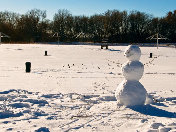 Day at Elm Creek Park Reserve beach, Snowman waiting for the Olympic swimming time trials. Elm Creek Park Reserve, Maple Grove, MN
