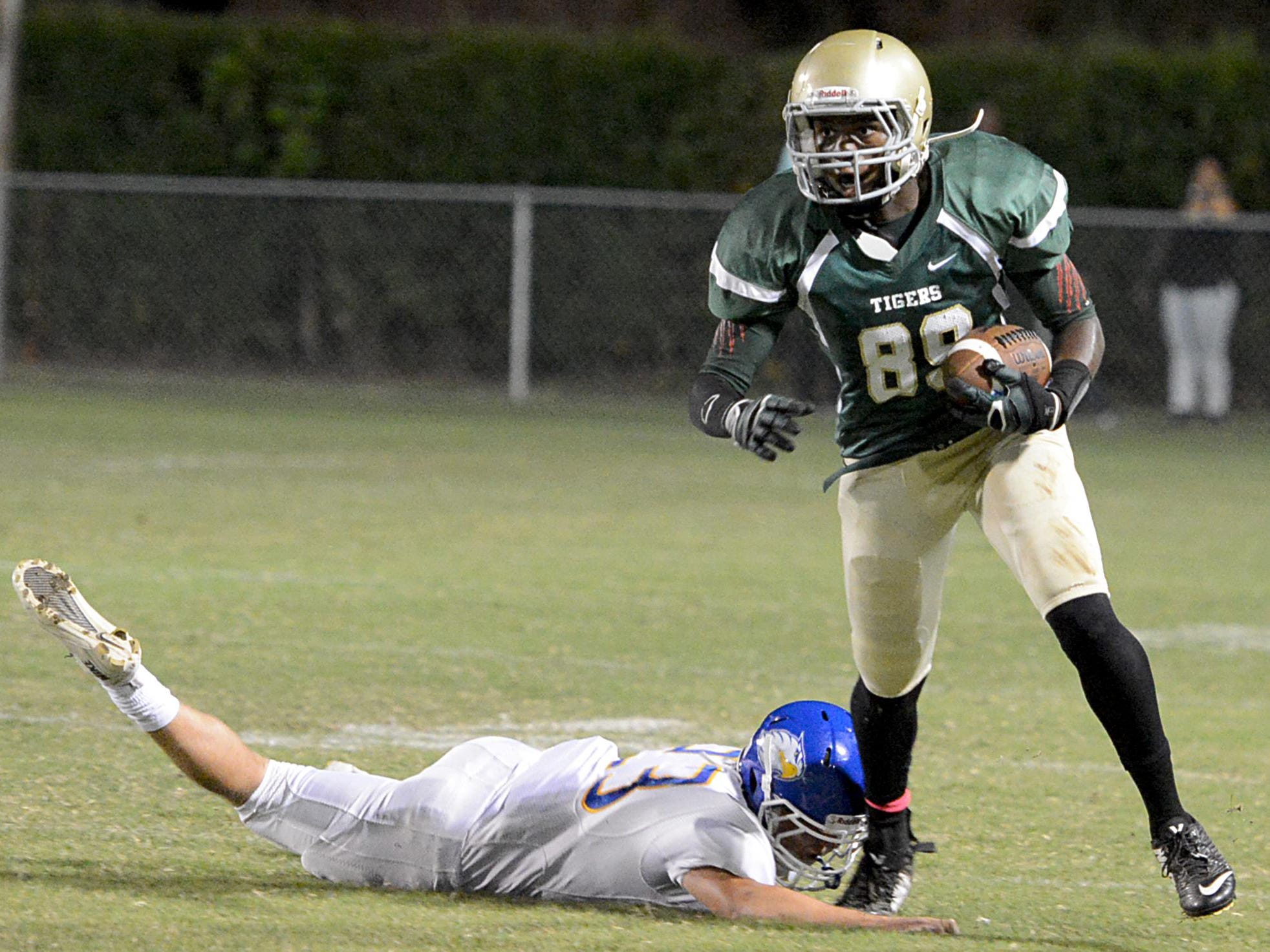 Bolivar's Javonte Crisp avoids a tackle from a Jackson Christian defender in a game last season.