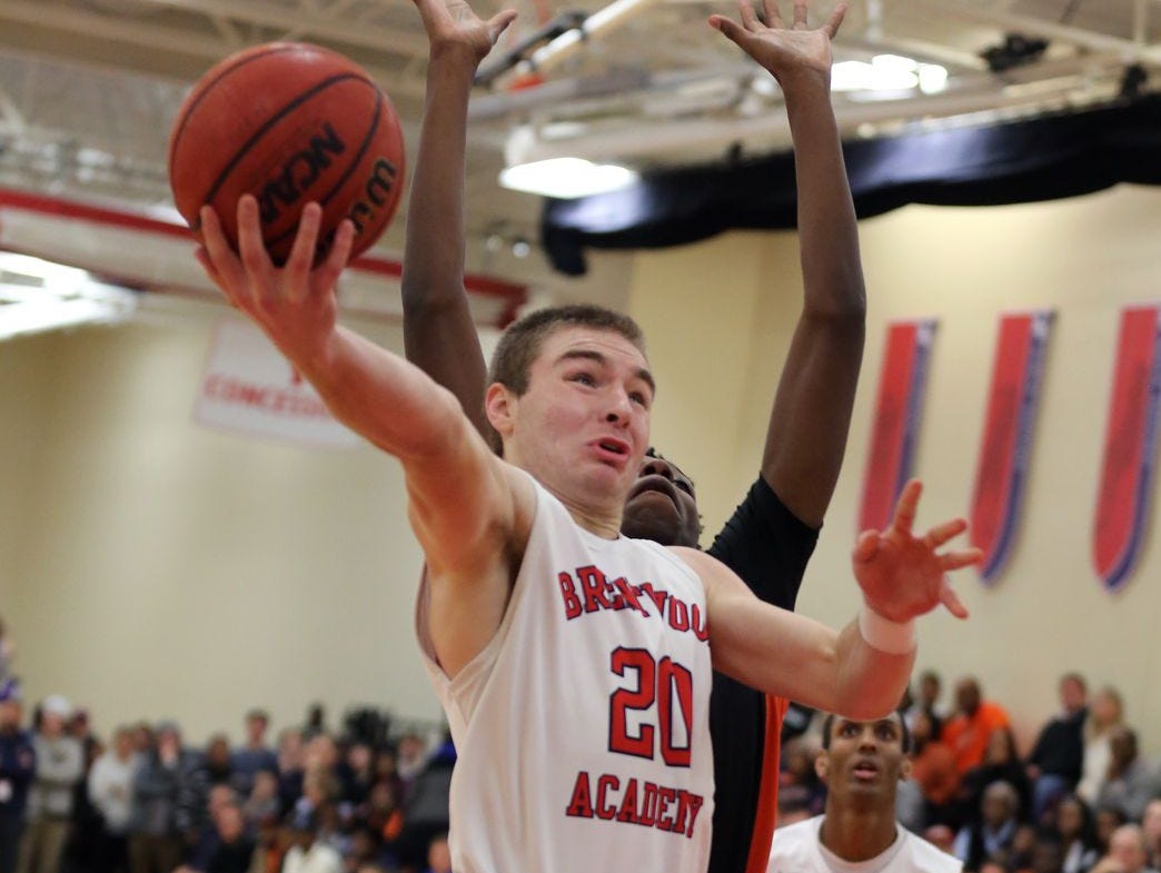 Brentwood Academy's Jeremiah Oatsvall elevates for a layup during Tuesday's win over Ensworth.