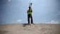 Surveyor Jason Rappe uses GPS technology to measure dunes in Mirlo Beach, N.C.