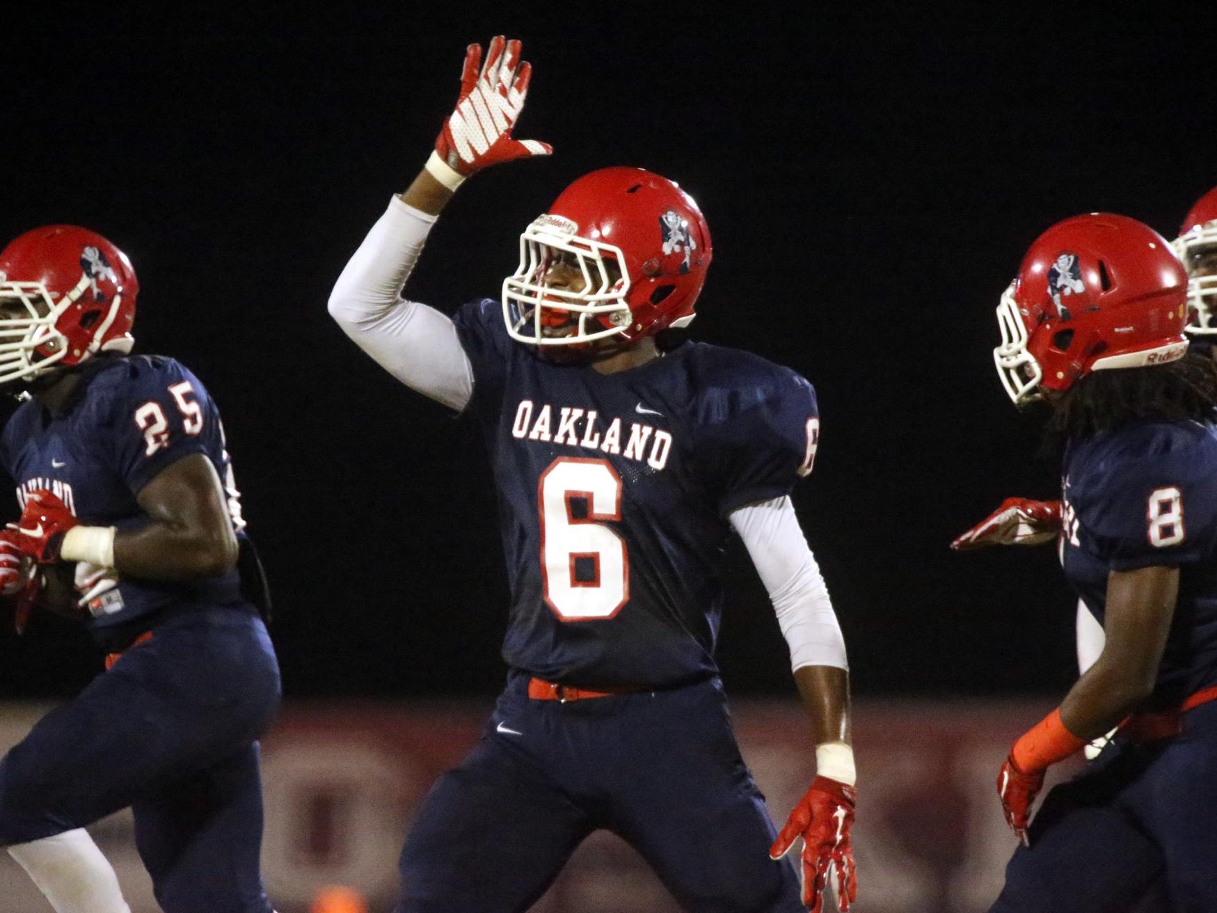 Oakland's Kaleb Oliver (6) celebrates making an interception during the game against Blackman at Oakland, on Friday Sept. 18, 2015.