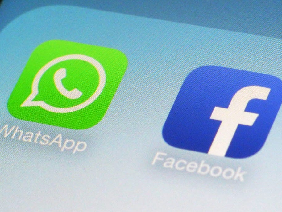 FILE - This Feb. 19, 2014 file photo shows the WhatsApp and Facebook app icons on an iPhone in New York. More ìheadline-grabbingî acquisitions are likely over the coming year as businesses take advantage of a period of improving economic growth and c