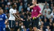 Tottenham Hotspur's Danny Rose is shown a yellow card