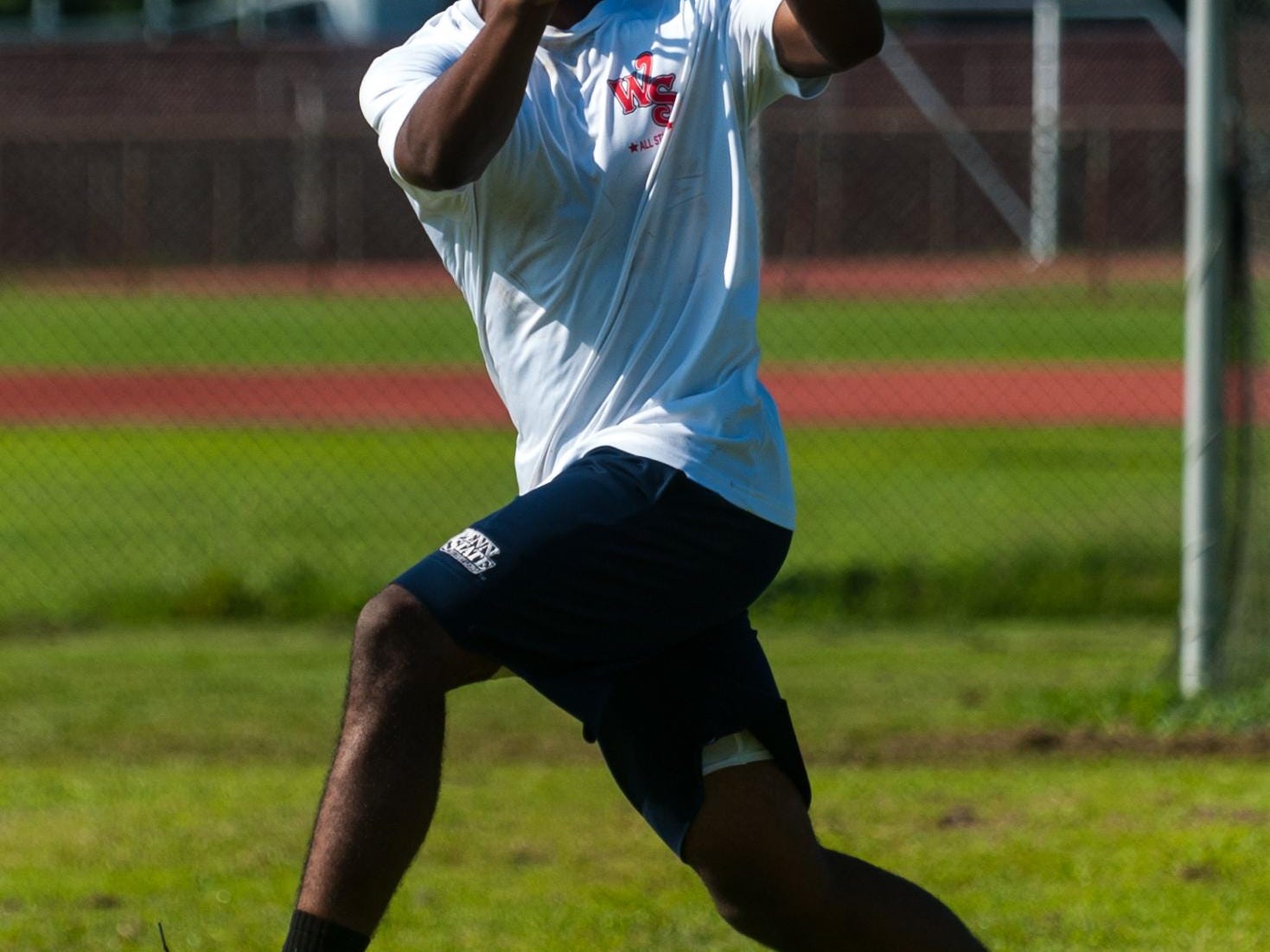 A Wicomico High defensive back goes into full extension.