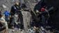 French rescue workers search through the debris of