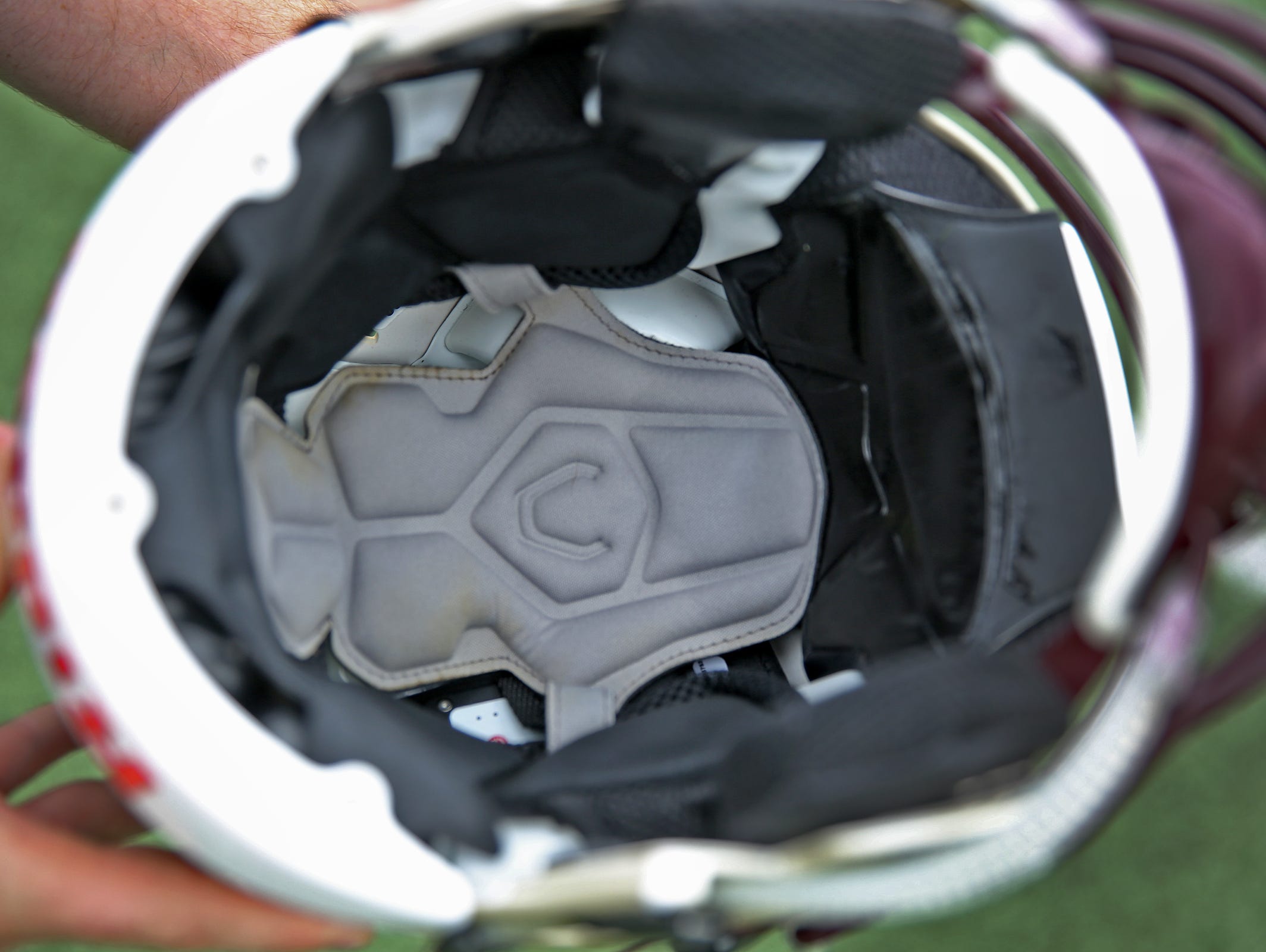 Under padding inside Brebeuf's helmets are sensors and a power source. If a player gets hit at a critical level, it will send an alert to the monitoring athletic trainer so that concussion protocol can be initiated.