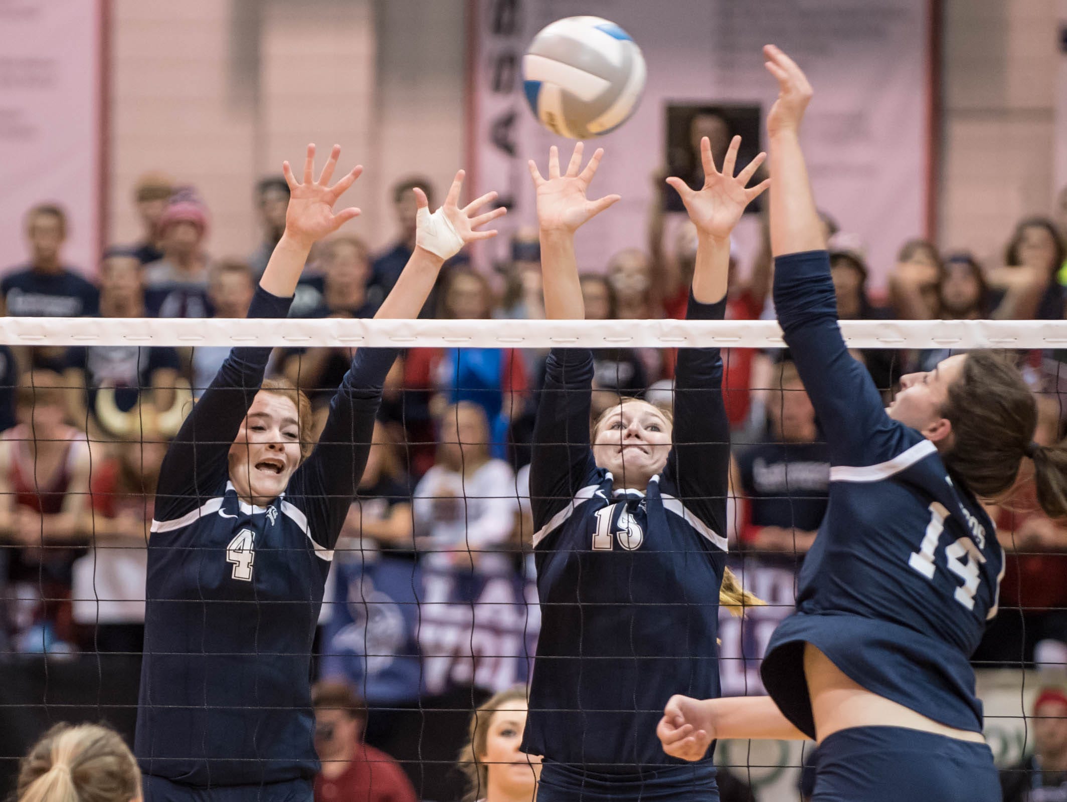 Lake Odessa Lakewood's Breanna Wickerink (4) and Alivia Benedict (15) go for the block during the Class B State Volleyball final against North Branch at the Kellogg Arena in Battle Creek on Saturday.