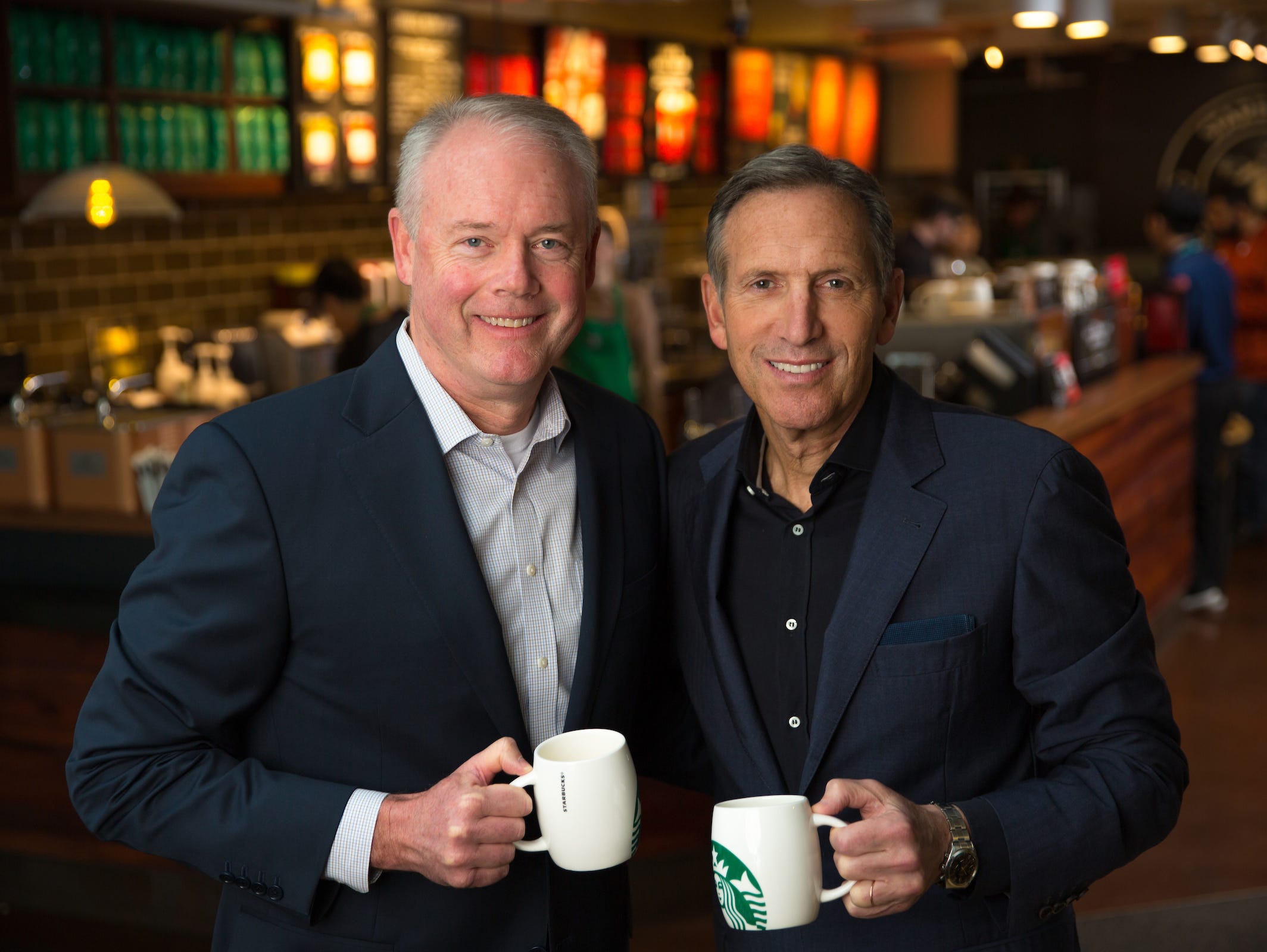 Kevin Johnson, Starbucks president and chief operating officer, is shown with Howard Schultz, chairman and chief executive officer, in a Starbucks store at the corporate headquarters in Seattle in December 2016.