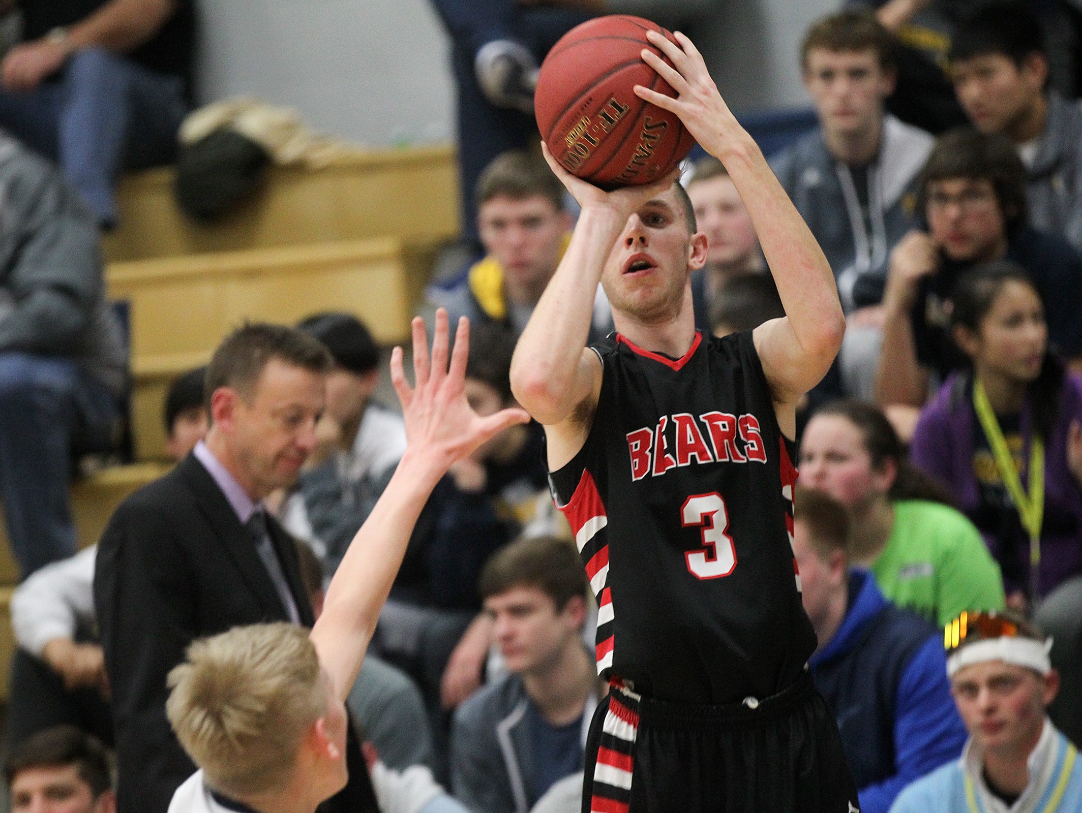West Branch's Beau Cornwell shoots a 3-pointer during the Bears' game at Regina on Friday, Dec. 16, 2016.