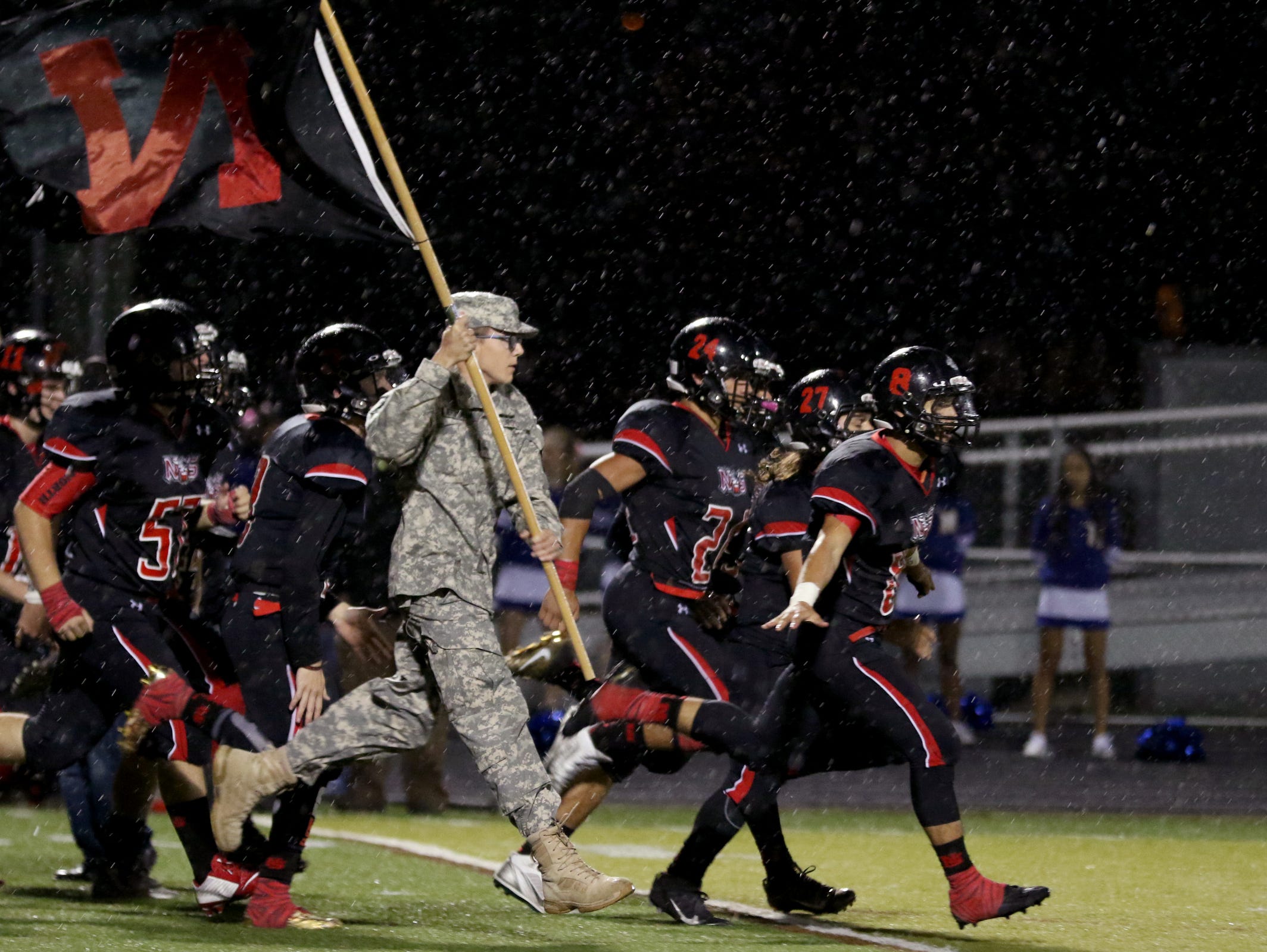 North Salem takes the field before the McKay vs. North Salem football game at North Salem High School on Friday, Oct. 21, 2016.