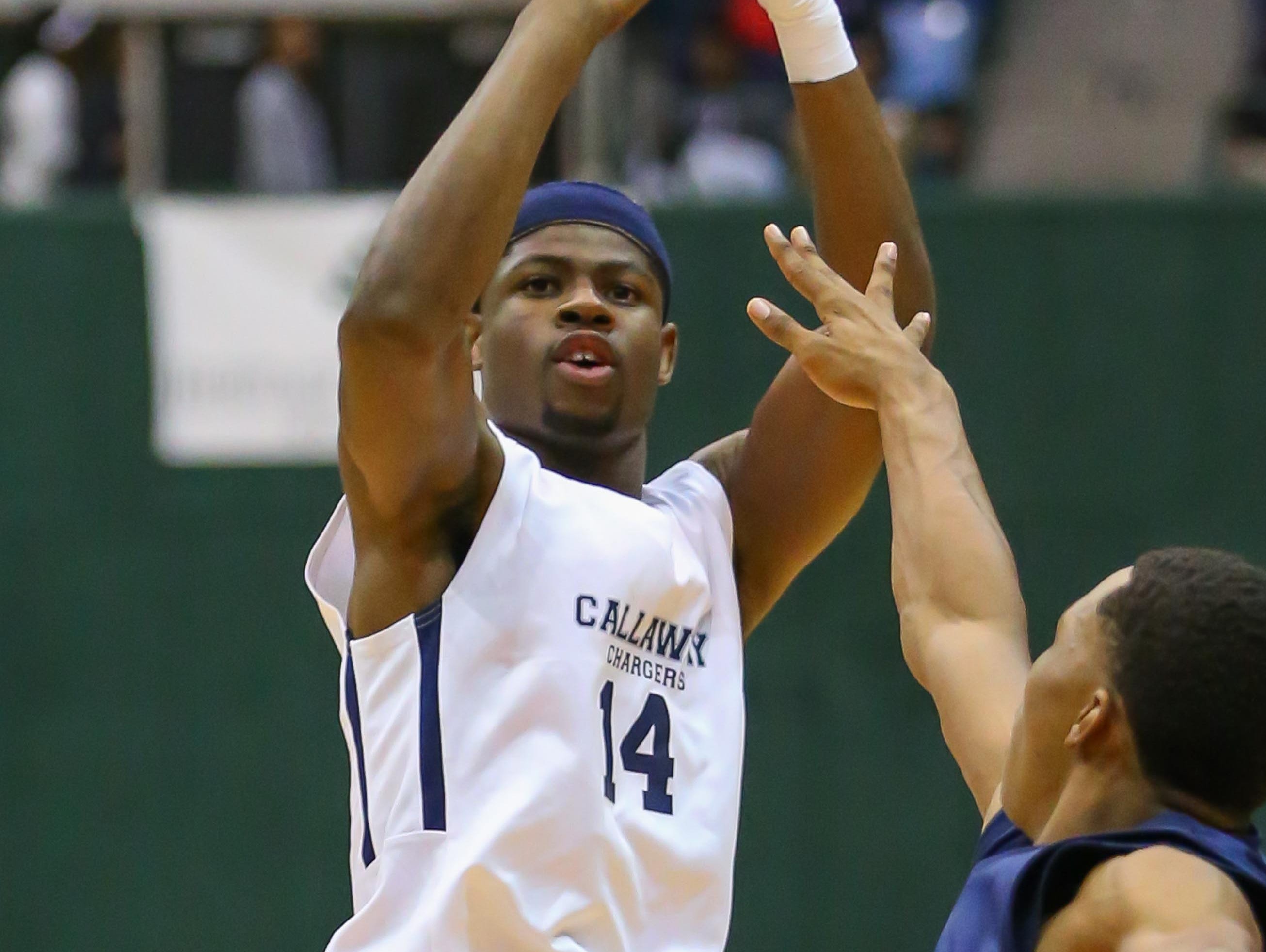 Callaway's Malik Newman (14) shoots against Ridgeland in the MHSAA Boys State 5A Basketball Championship Finals action held in Jackson at the Mississippi Coliseum.