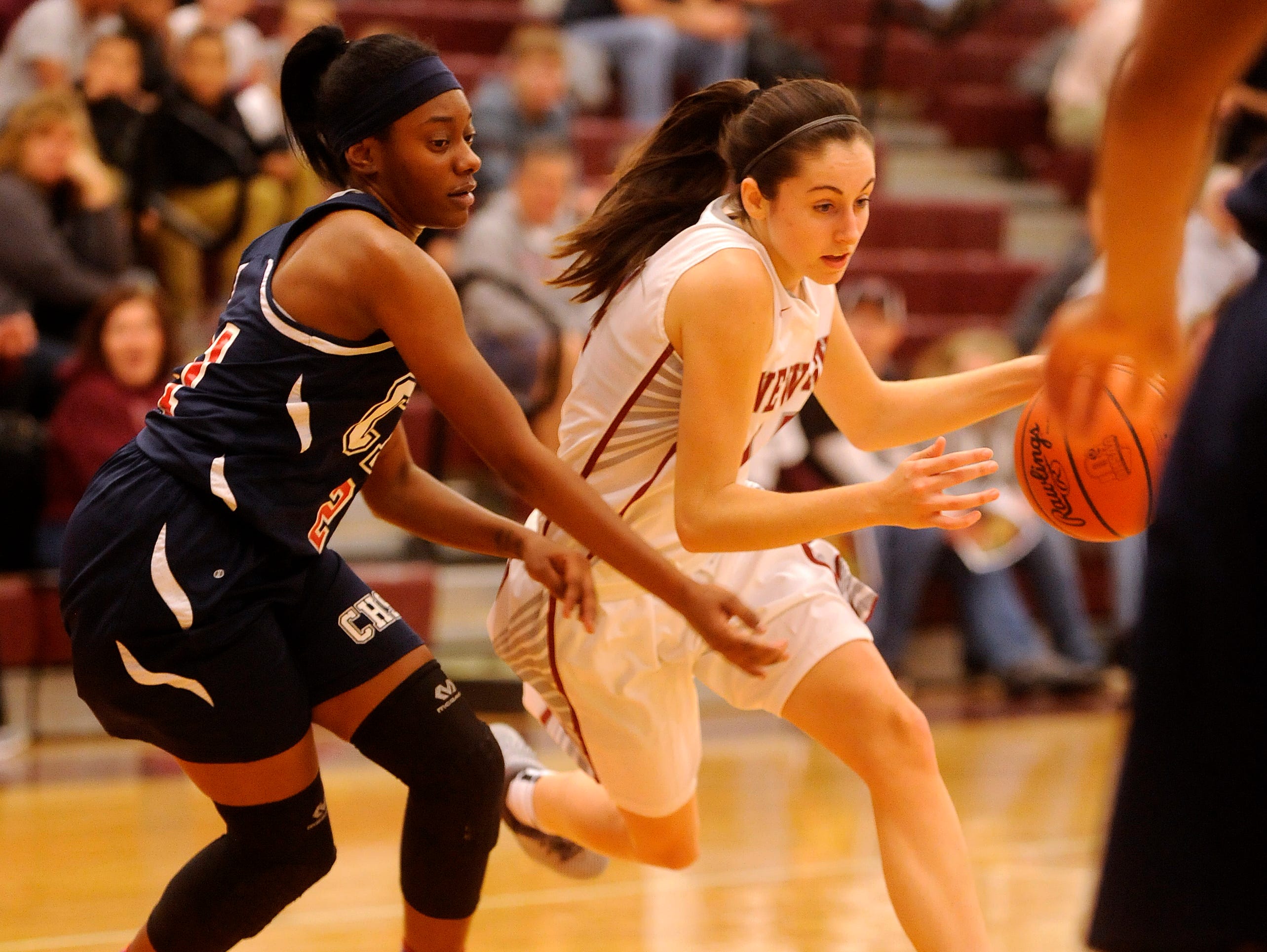 Newark's Katie Shumate dodges Centennial defenders Akiya Brown during an OHSAA Foundation Games on Tuesday, Nov. 17, 2015.