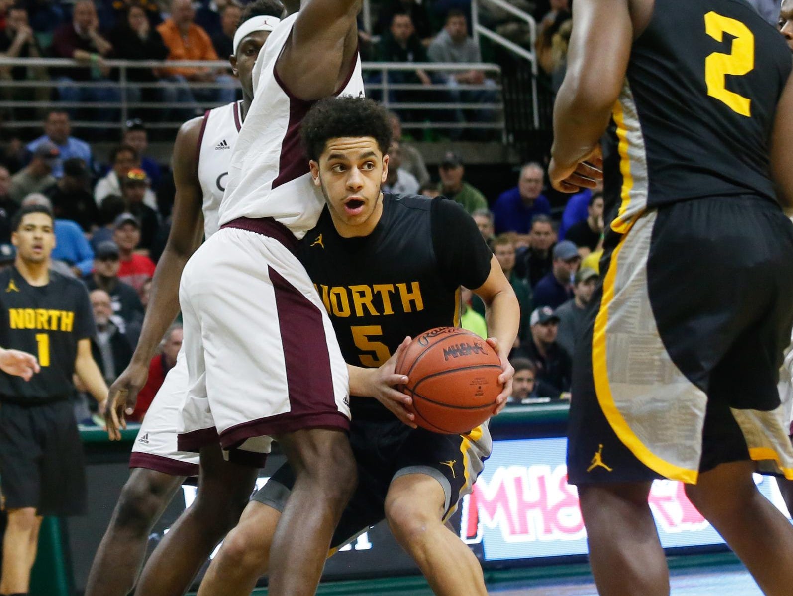 North Farmington's Jacob Joubert looks to pass the ball Saturday. His father, Antoine Joubert, also played in the state finals.
