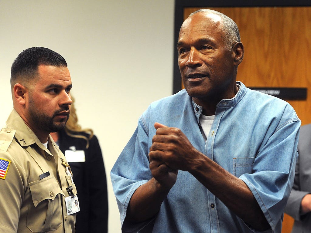 O.J. Simpson reacts after learning he was granted parole at Lovelock Correctional Center in Lovelock, Nev.
