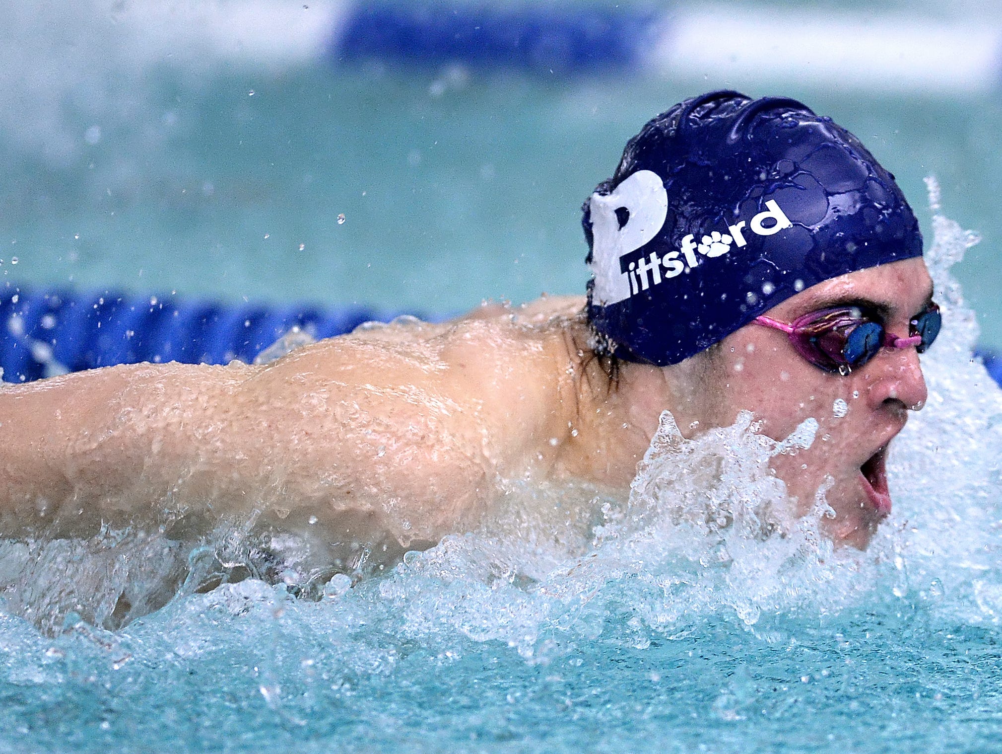 Pittsford's Casey Ransford wins the 100 butterfly with a time of 55.14.