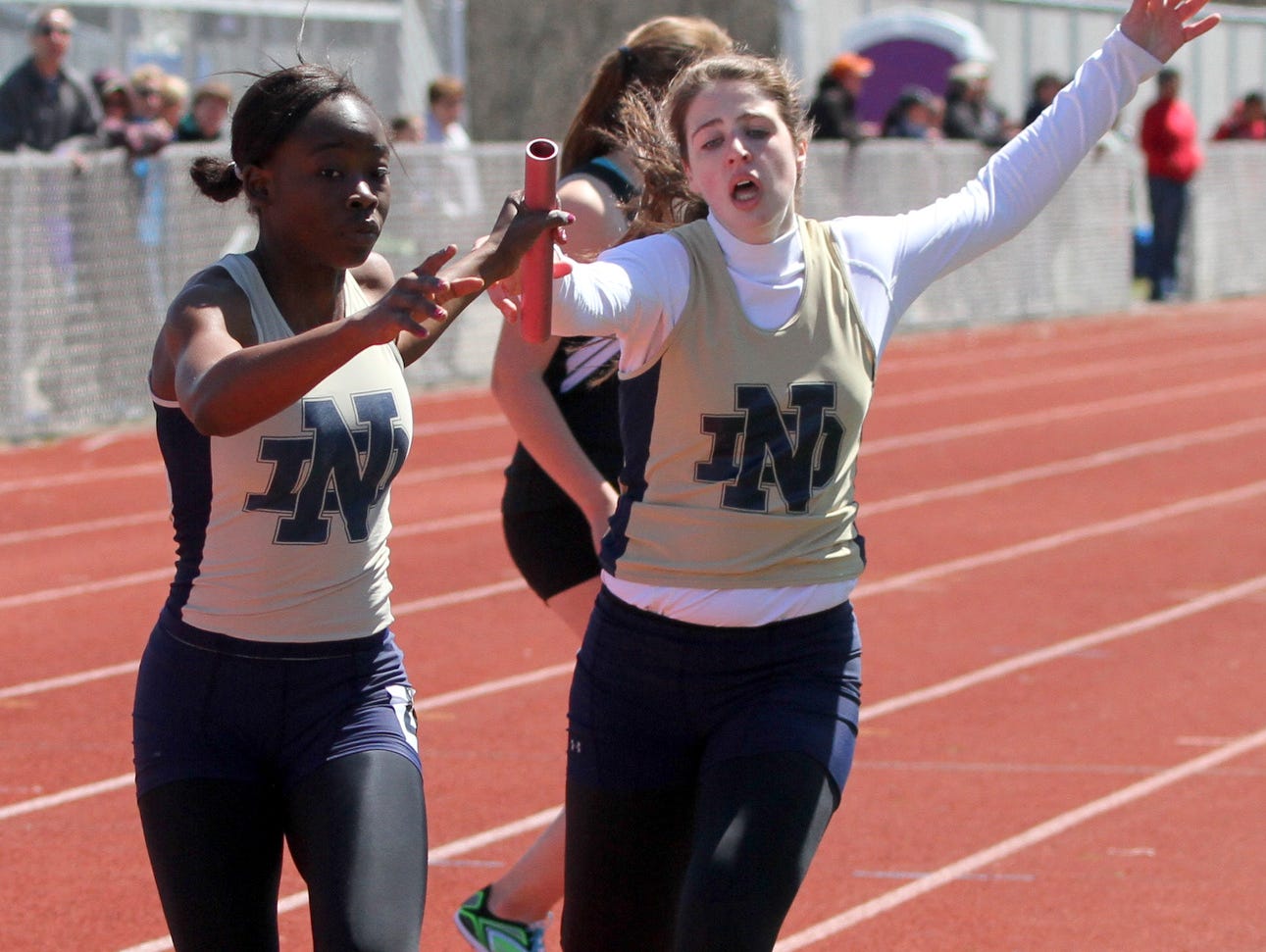 Deb Diarra takes the baton for Notre Dame during a win in the 3,200 relay earlier this season at the Waite-Molnar Invitational at Ernie Davis Academy. The Crusaders will try for their third straight girls Large School title on Thursday and Friday at Trumansburg High School.