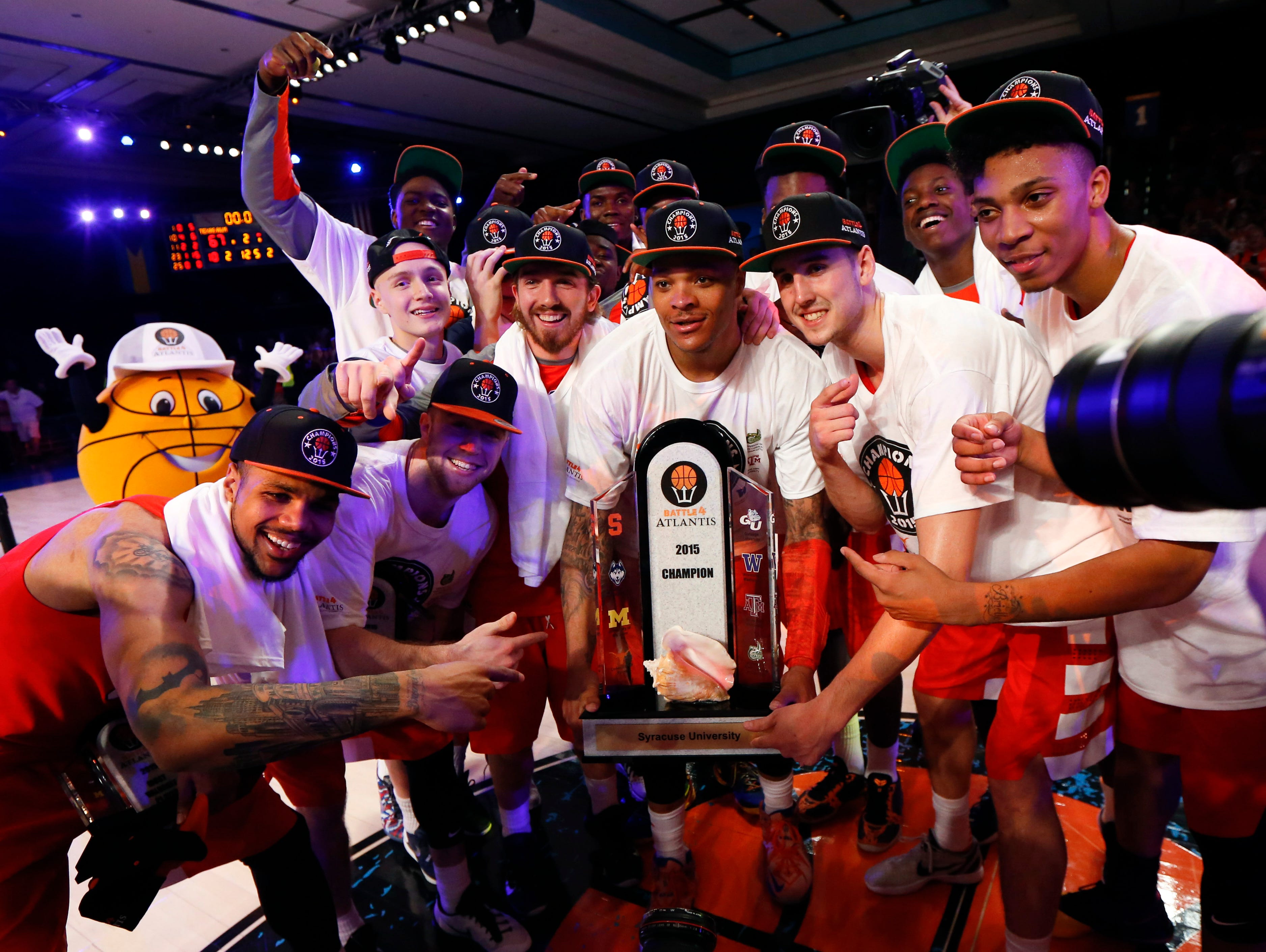 Syracuse Orange players celebrate winning the championship against the Texas A&M Aggies in the 2015 Battle 4 Atlantis championship.