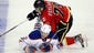 Sept. 14: Edmonton Oilers defenseman Jeff Petry, left, grimaces as Calgary Flames' Michael Ferland crashes down on him in a split-squad game.