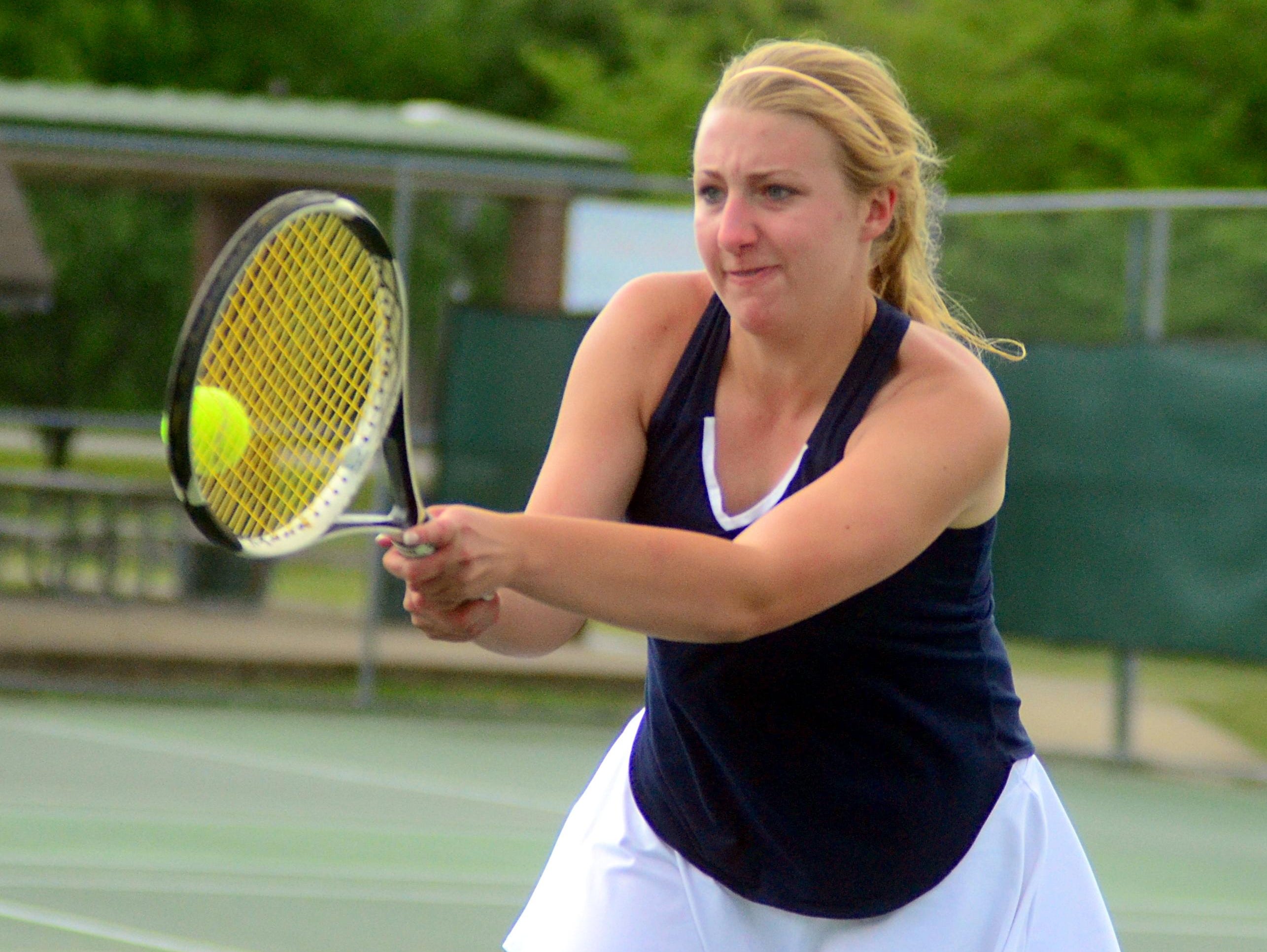 Beech High senior Allie Guinn volleys at the net during Wednesday’s doubles semifinals.